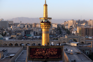 Servants change dome flag at Imam Reza (AS) shrine