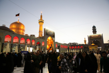 Servants change dome flag at Imam Reza (AS) shrine