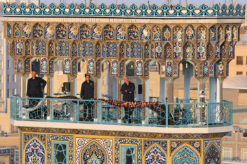 Servants change dome flag at Imam Reza (AS) shrine