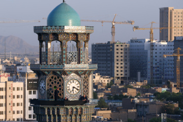 Servants change dome flag at Imam Reza (AS) shrine