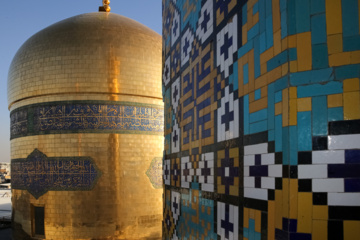 Servants change dome flag at Imam Reza (AS) shrine