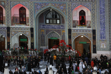 Servants change dome flag at Imam Reza (AS) shrine