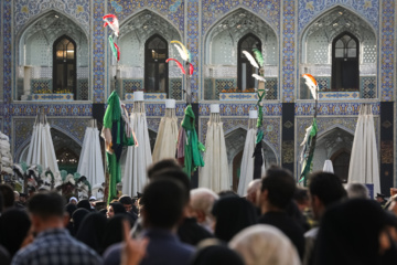 Servants change dome flag at Imam Reza (AS) shrine