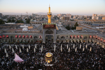 Servants change dome flag at Imam Reza (AS) shrine