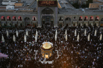 Servants change dome flag at Imam Reza (AS) shrine