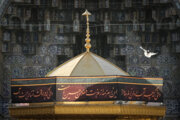 Servants change dome flag at Imam Reza (AS) shrine