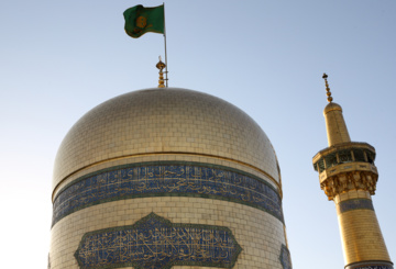 Servants change dome flag at Imam Reza (AS) shrine