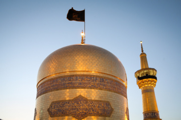 Servants change dome flag at Imam Reza (AS) shrine