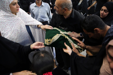 Servants change dome flag at Imam Reza (AS) shrine